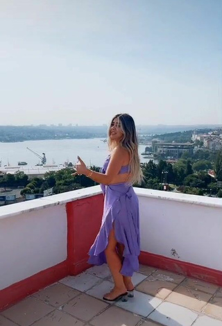 Sultry Gizemjelii in Purple Crop Top on the Balcony