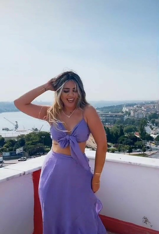 3. Sultry Gizemjelii in Purple Crop Top on the Balcony