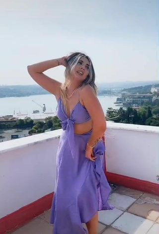 4. Sultry Gizemjelii in Purple Crop Top on the Balcony