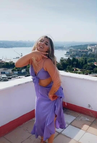 5. Sultry Gizemjelii in Purple Crop Top on the Balcony