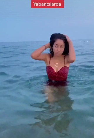 2. Sultry Haticeaknn Shows Cleavage in Red Swimsuit in the Sea