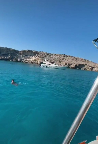 4. Sultry Rina in Blue Bikini on a Boat