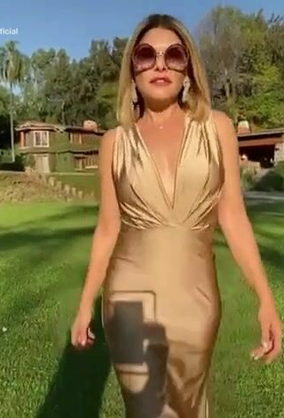 Sultry Tati Cantoral in Golden Dress