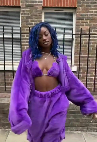 Sultry Oluwanifewa Agunbiade Shows Cleavage in Violet Bikini Top in a Street