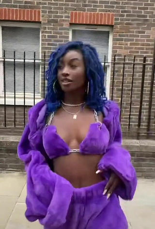 2. Sultry Oluwanifewa Agunbiade Shows Cleavage in Violet Bikini Top in a Street