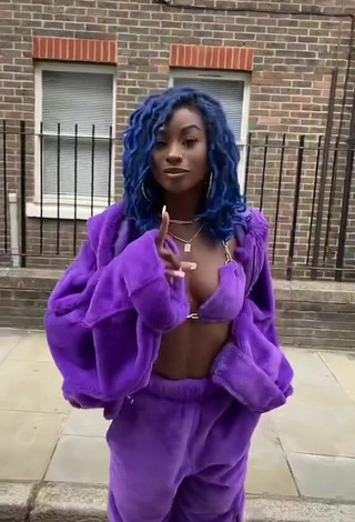 3. Sultry Oluwanifewa Agunbiade Shows Cleavage in Violet Bikini Top in a Street