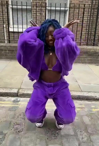 5. Sultry Oluwanifewa Agunbiade Shows Cleavage in Violet Bikini Top in a Street