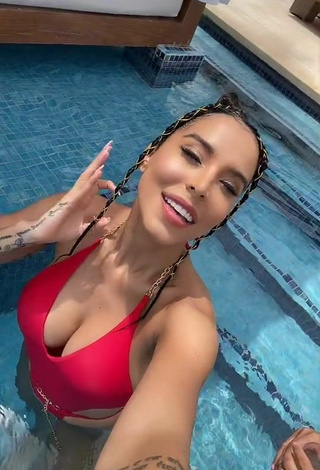 Sultry Jessi Pereira Shows Cleavage in Red Swimsuit at the Pool