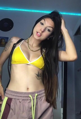 2. Julia Guerra Looks Seductive in Yellow Bikini Top