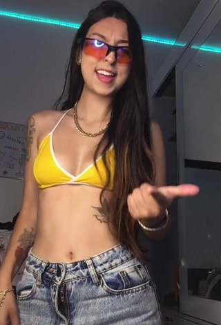 6. Julia Guerra Shows Cleavage in Sweet Yellow Sport Bra