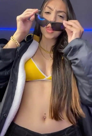 3. Julia Guerra Shows Cleavage in Alluring Yellow Sport Bra