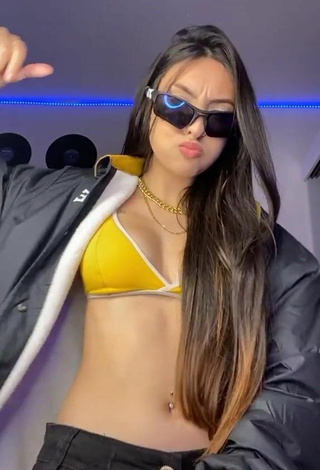 6. Julia Guerra Shows Cleavage in Alluring Yellow Sport Bra