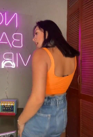 6. Luscious Karen Bustillos in Orange Crop Top