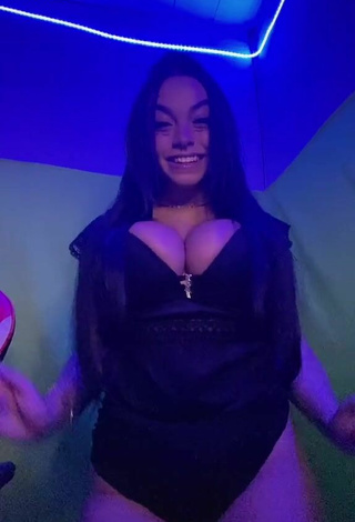 2. Cute Karniello Shows Cleavage in Black Bodysuit