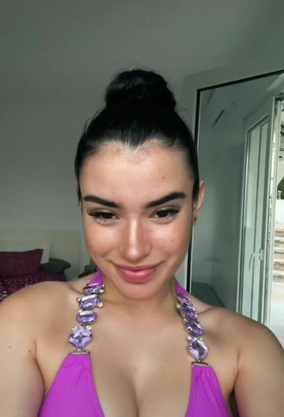 Really Cute Kiara Brunett Shows Cleavage in Violet Bikini Top