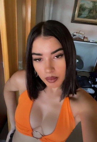 3. Hottie Kiara Brunett Shows Cleavage in Orange Crop Top