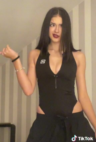 5. Sultry Liza Nice Shows Cleavage in Black Bodysuit