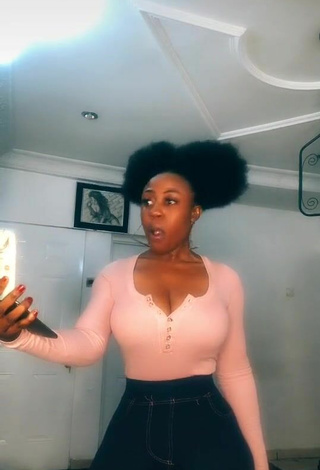 3. Luscious Lilly Chioma Shows Cleavage in Pink Top