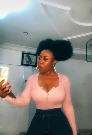 4. Luscious Lilly Chioma Shows Cleavage in Pink Top