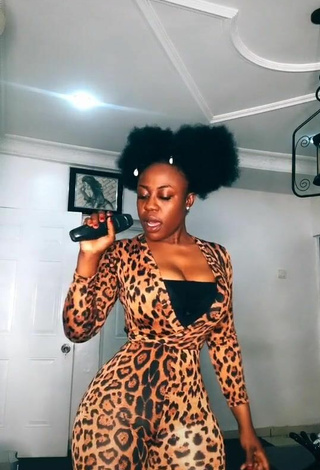 Sultry Lilly Chioma Shows Cleavage in Top