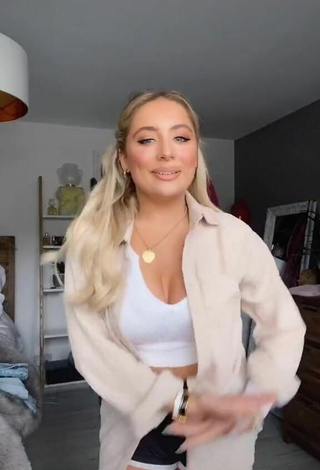 Sultry Saffron Barker Shows Cleavage in White Crop Top