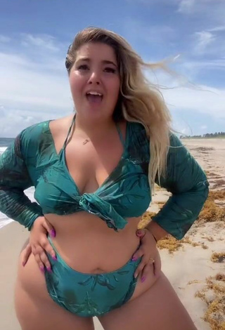 Sultry Sam Paige Shows Cleavage in Green Bikini at the Beach