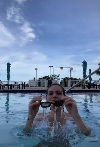 5. Pretty Sasha Ferro Shows Cleavage in White Bikini at the Pool