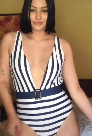 2. Sultry Valeria Figueroa Shows Cleavage in Striped Swimsuit