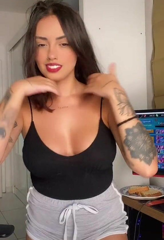 Amazing Vitoria Marcilio Shows Cleavage in Hot Black Top