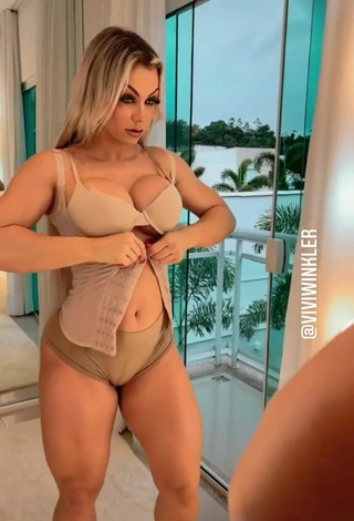 Sultry Vivi Winkler Shows Cleavage in Beige Bra