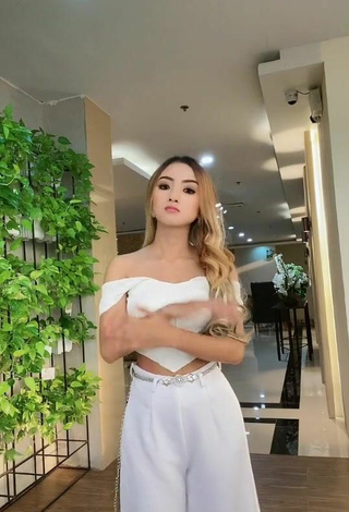 Titillating Raven Charizz in White Crop Top