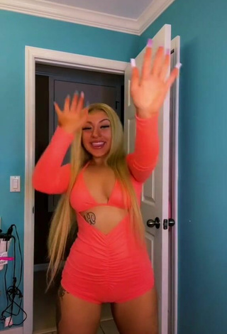 5. Titillating Alli Haas Shows Cleavage in Orange Overall