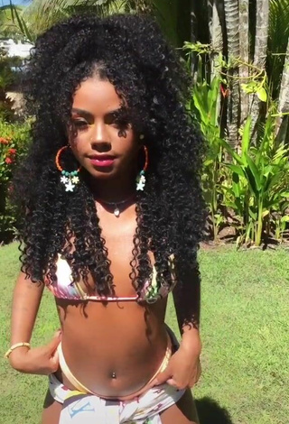 Sultry Angel Oficial Shows Cleavage in Bikini