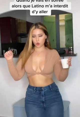 Sexy Anissa Shows Cleavage in Beige Crop Top