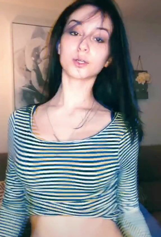 5. Luscious Arianna Roman Shows Cleavage in Striped Crop Top