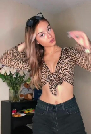 2. Titillating Arianna Roman Shows Cleavage in Leopard Crop Top