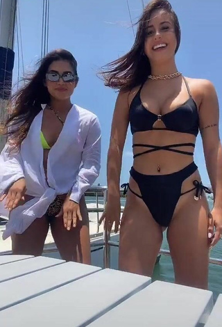 3. Cute Bianca Jesuino Shows Cleavage in Black Bikini on a Boat