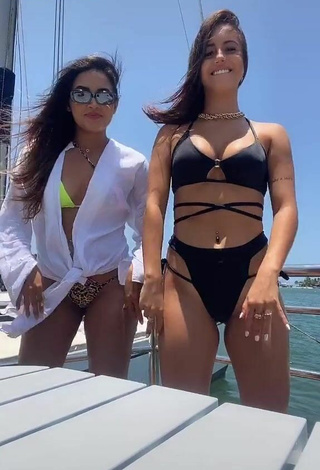 4. Cute Bianca Jesuino Shows Cleavage in Black Bikini on a Boat