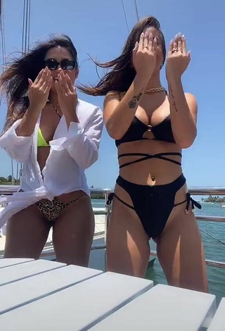 6. Cute Bianca Jesuino Shows Cleavage in Black Bikini on a Boat