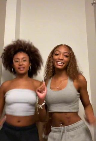 Sultry Davine Riley Shows Cleavage in Grey Crop Top