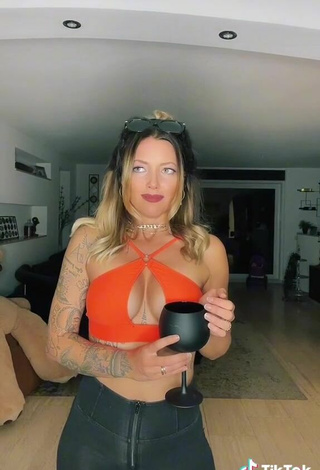 4. Hot Aline Jost Shows Cleavage in Orange Crop Top (Side Boob)