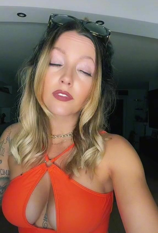 6. Sexy Aline Jost Shows Cleavage in Orange Crop Top (Side Boob)