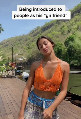 4. Luscious Kaory Desole Shows Cleavage in Orange Crop Top