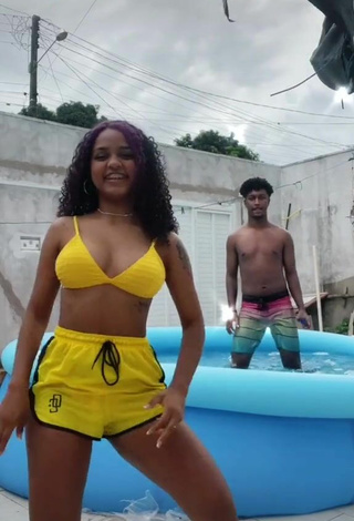 5. Sultry Radija Pereira Shows Cleavage in Yellow Bikini Top