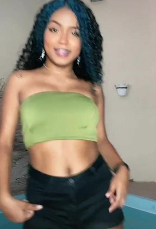 Luscious Radija Pereira Shows Cleavage in Olive Tube Top