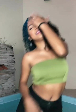 4. Luscious Radija Pereira Shows Cleavage in Olive Tube Top