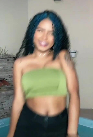 5. Luscious Radija Pereira Shows Cleavage in Olive Tube Top