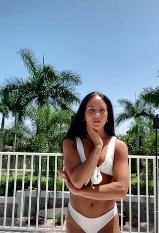 Titillating Gabi Butler Shows Cleavage in White Bikini