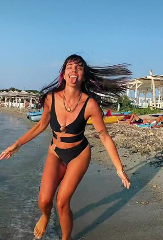 3. Sultry Giulia Penna Shows Cleavage in Black Swimsuit at the Beach (Underboob, Side Boob)