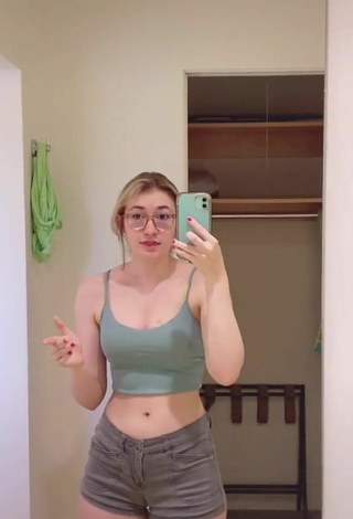 2. Sexy Sydney Shows Cleavage in Olive Crop Top